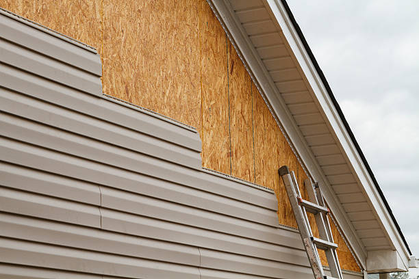 Professional Storm Damage Siding Repair technician working in Cleves, OH
